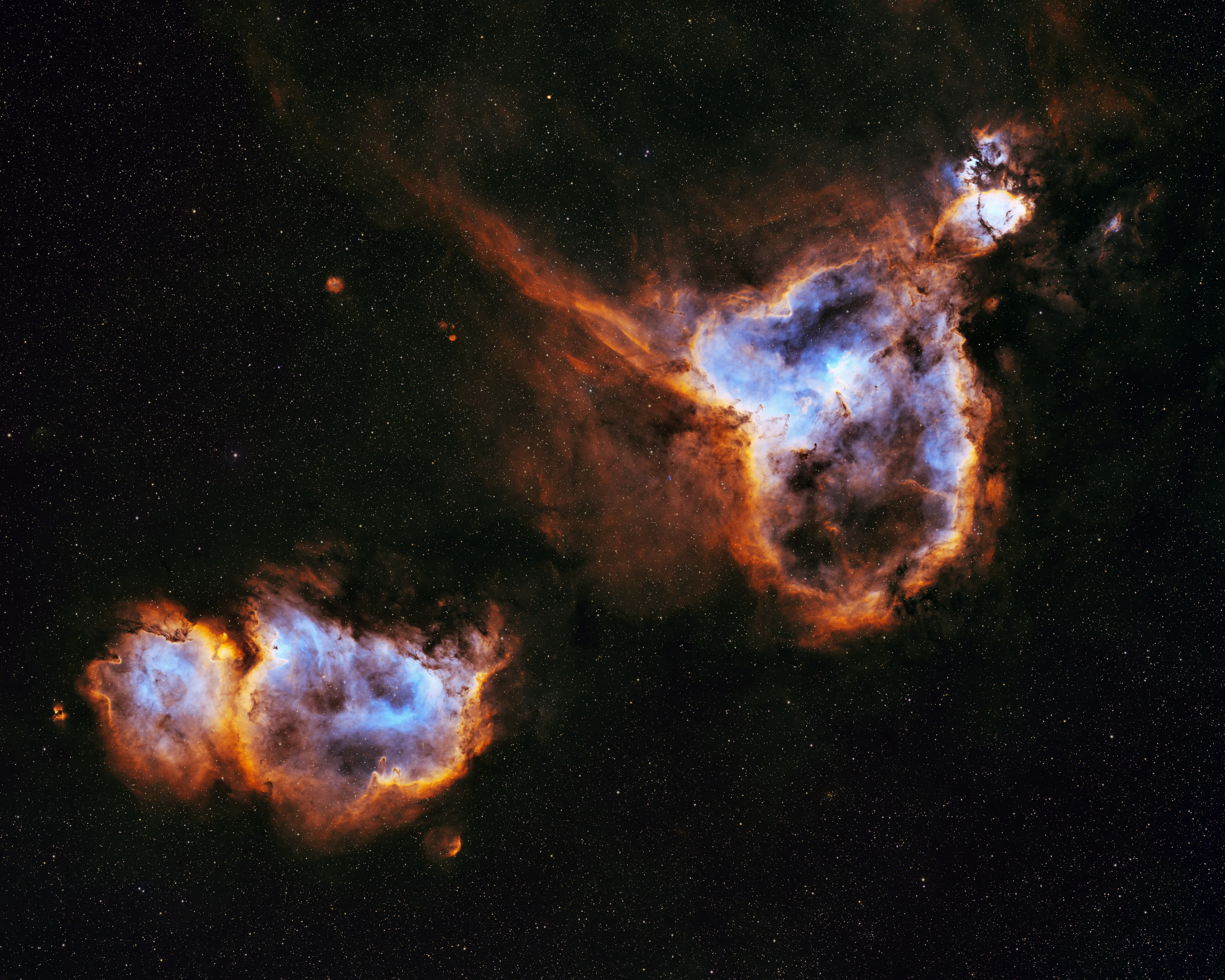The Heart and Soul Nebulae in Cassiopeia in Hubble-palette colors